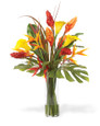 Perfect Paradise Faux Flower Tropical Arrangement in a 12” tall glass cylinder vase of clear acrylic water. Available at Petals.